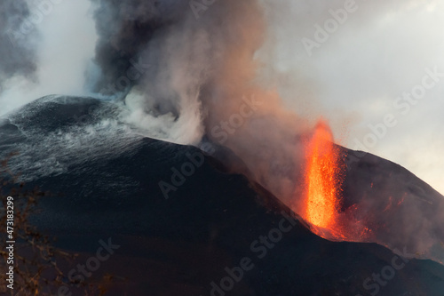 Cumbre Vieja / La Palma (Canary Islands) 2021/10/26. View of the two main vents of Cumbre Vieja's volcano eruption. One throws lava, the other, black smoke.