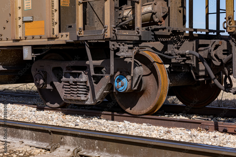 Naklejka premium Freight train cars on railroad tracks. Supply chain, rail transportation and shipping concept