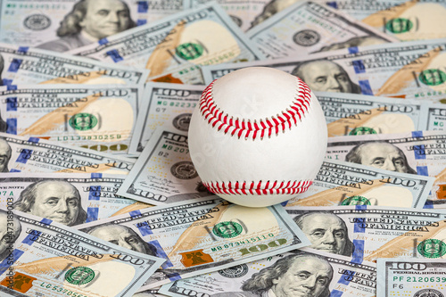 Baseball with cash money. Sports strike, lockout and sports betting concept.