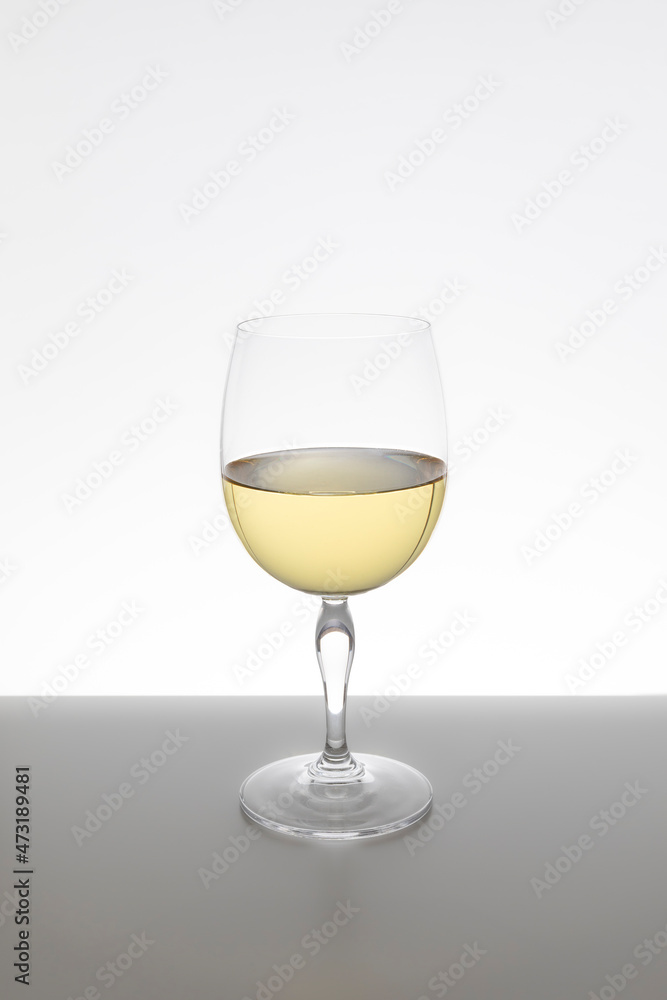 Glass of white wine on white background Glass of white wine on white background