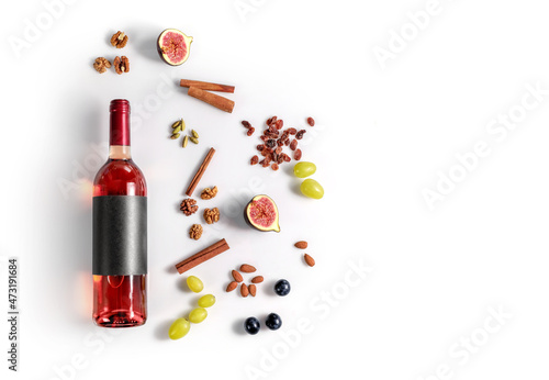 Rose wine and possibble ingredients of grape, cinnamon, figs isoalted on white background
