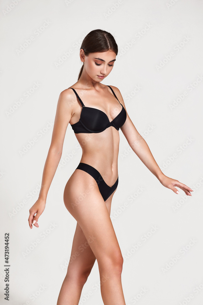 Fototapeta premium gorgeous slim woman with perfect body in black underwear