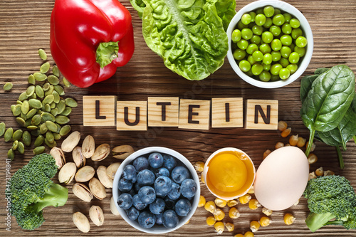 Food sources of lutein and zeaxanthin. Foods as yolk egg, broccoli, pumpkin seeds, pepper, lettuce, green peas, spinach, blueberries, corn and pistachios. photo