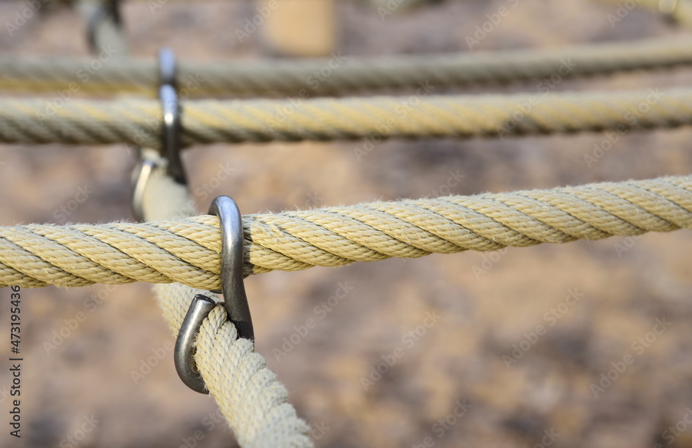close up of ropes tied together with metal clasps close up of ropes tied together with metal clasps