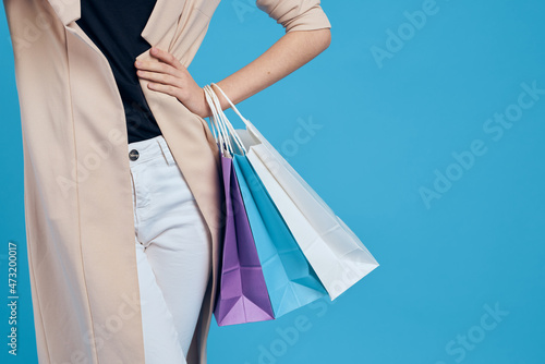 cheerful woman multicolored packs emotions shopping fashion blue background