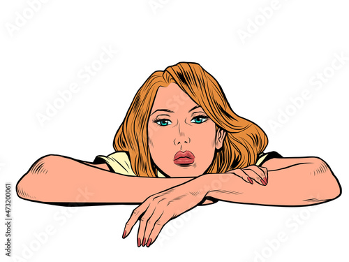 the woman is lying with her head on her hands, looking straight