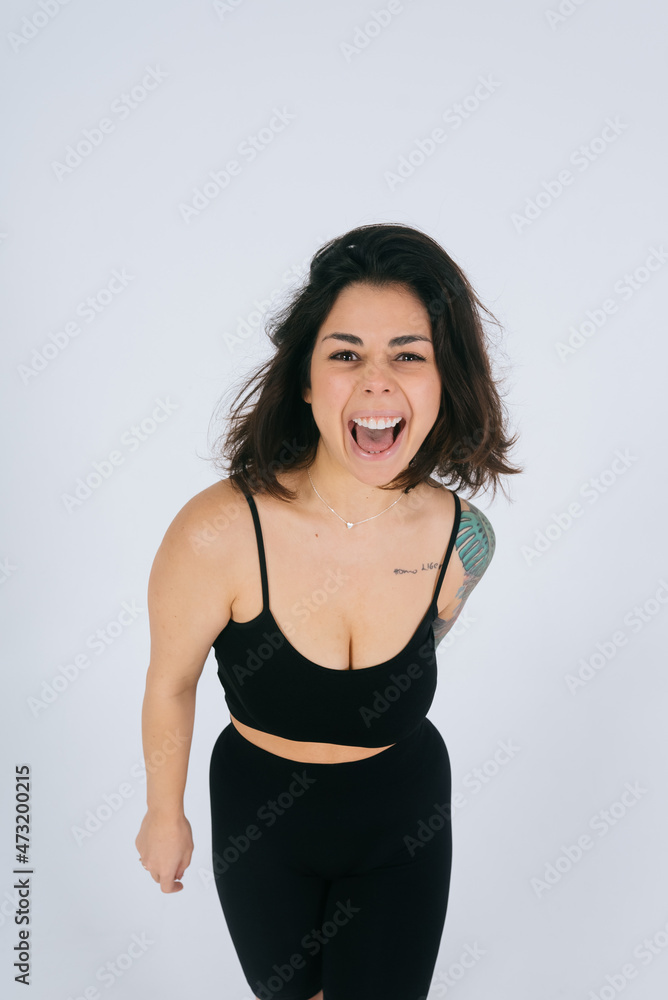 An ordinary young woman on a white background. Bodypositive concept. An ordinary young woman on a white background. Bodypositive concept.