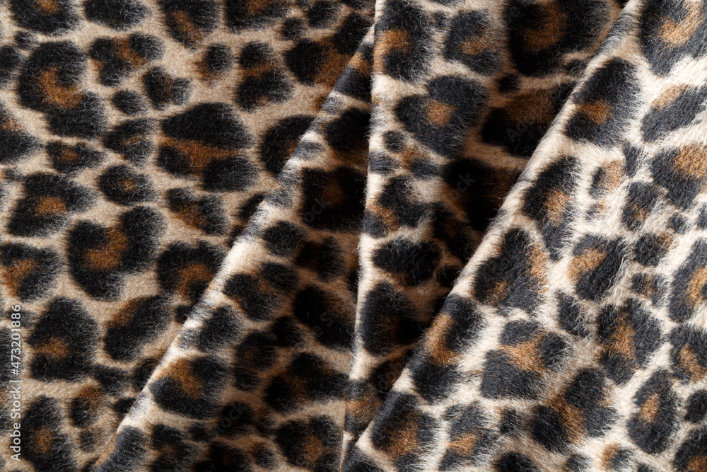 leopard-print coat folded in straight folds leopard-print coat folded in straight folds