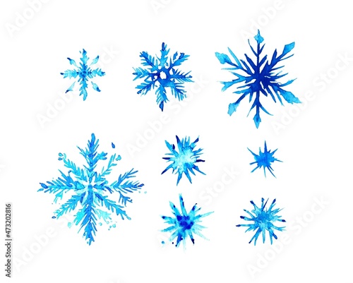 Watercolor snowflakes, Watercolor splash, isolated snowflakes, granulation effect on paper. Winter illustration big and small snowflakes 