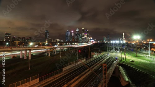 timelapse with tracers of traffic at night on the TTK, MCD, Moscow city downtown from the side of Zvenigorodskoe highway in Moscow, Russia photo