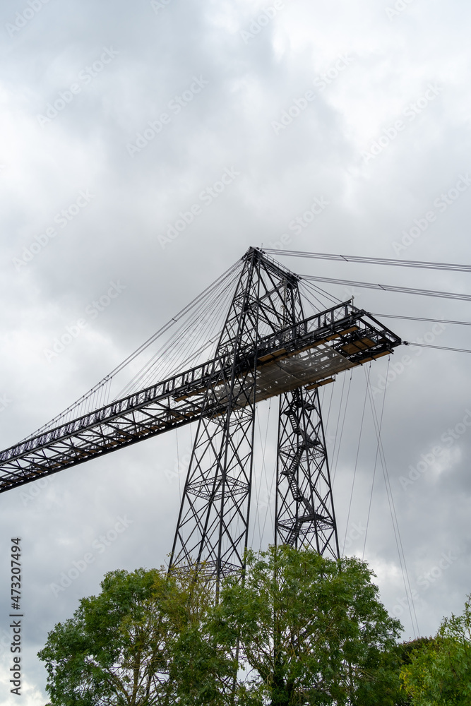 Transporter Bridge over the Charente river under a cloudy sky. National monument. Rochefort sur mer. France
