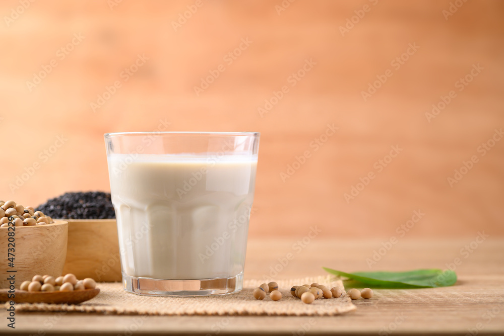 Soy milk with black sesame on wooden background, Healthy drink