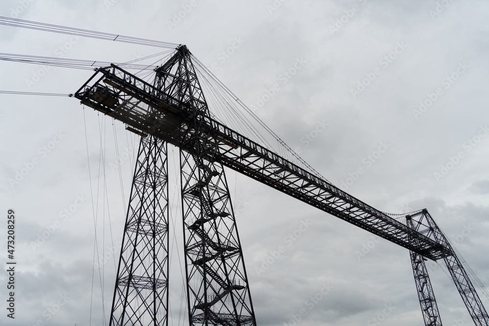Transporter Bridge over the Charente river under a cloudy sky. National monument. Rochefort sur mer. France Transporter Bridge over the Charente river under a cloudy sky. National monument. Rochefort sur mer. France