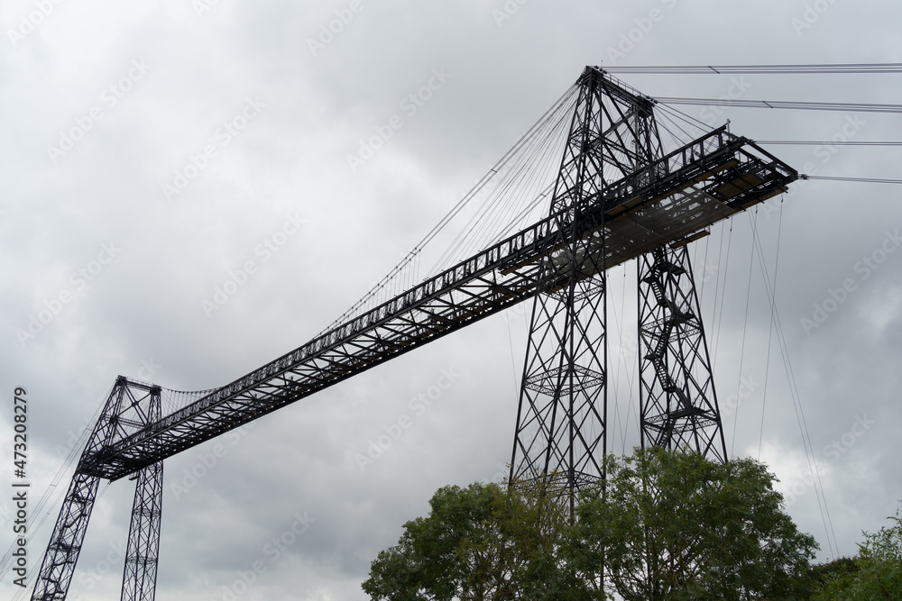 Transporter Bridge over the Charente river under a cloudy sky. National monument. Rochefort sur mer. France Transporter Bridge over the Charente river under a cloudy sky. National monument. Rochefort sur mer. France