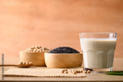 Soy milk with black sesame on wooden background, Healthy drink