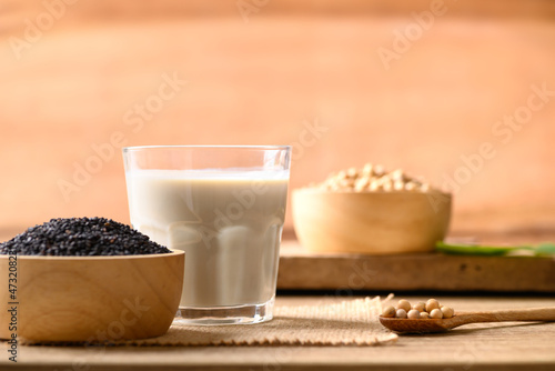 Soy milk with black sesame on wooden background, Healthy drink