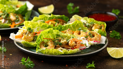 Lettuce wraps with Spicy prawn, shrimp and rice vermicelli noodles. Asian style finger party food