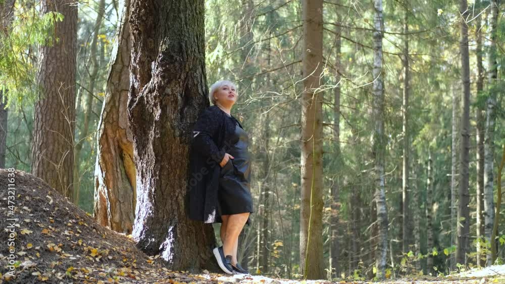 plus size model in sunny forest plus size model in sunny forest