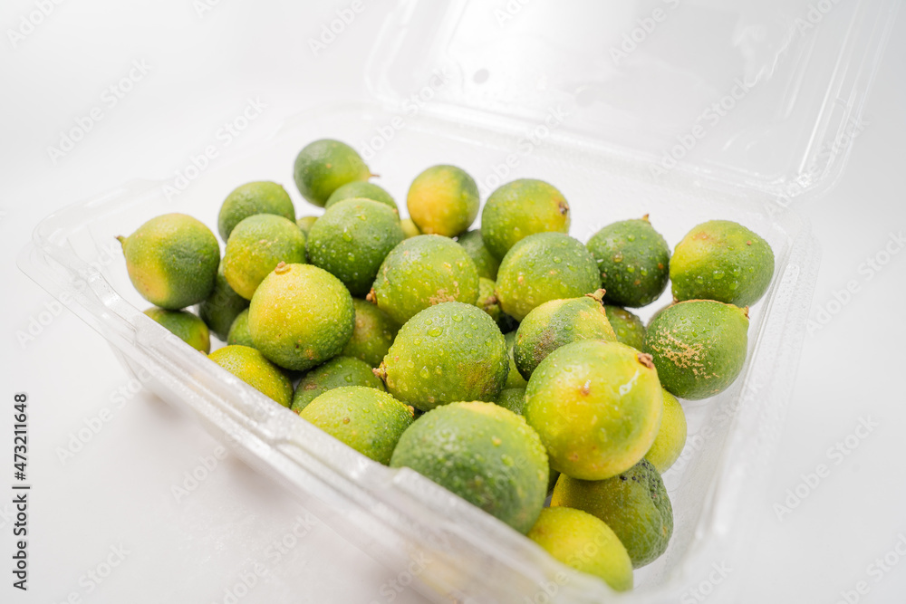 Fresh little limes on pure white background Fresh little limes on pure white background