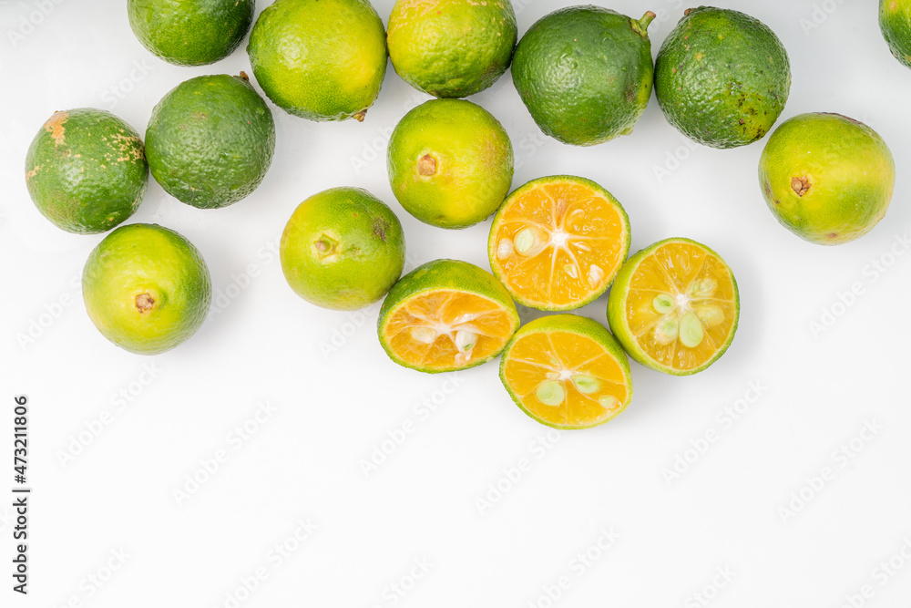 Fresh little limes on pure white background