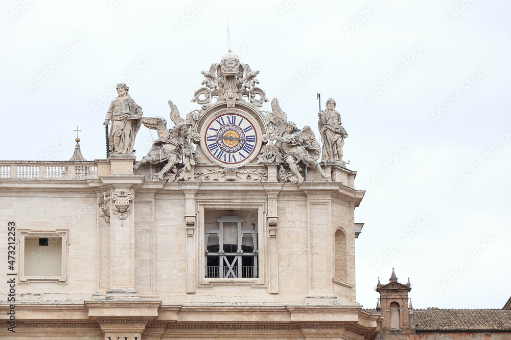 St Peter's Basilica Exterior Close Up with Sculptures and Italic Time Clock in Rome, Italy