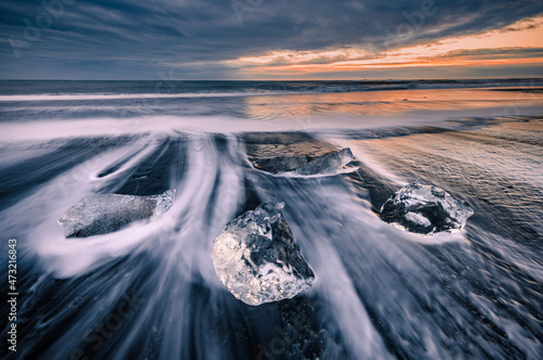 ice on black sand Diamond Beach in Iceland 