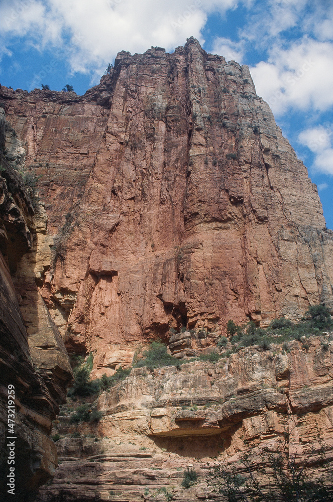 Rugged red rock face seen by hikers on the North Kaibab Trail in the Grand Canyon
