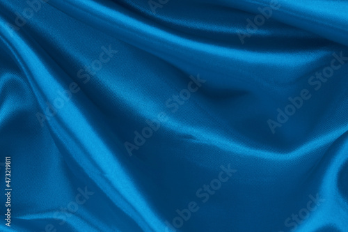 Dark blue fabric texture background, detail of silk or linen pattern.