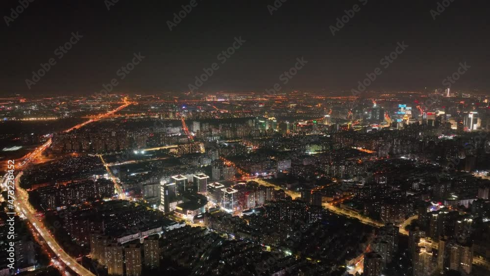 Shanghai cityscape in the night with lights from buildings and traffic. Travel, business and city life concept b-roll footage Shanghai China, Traffic light bands in the city. Buildings and landmarks Shanghai cityscape in the night with lights from buildings and traffic. Travel, business and city life concept b-roll footage Shanghai China, Traffic light bands in the city. Buildings and landmarks
