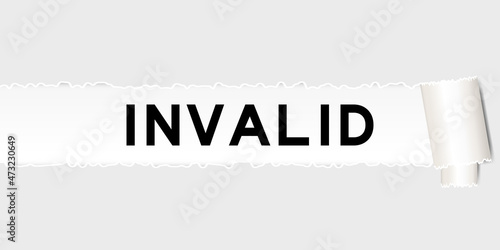 Ripped gray paper background that have word invalid under torn part