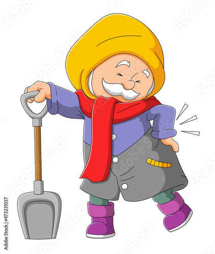 The grandpa has gout while digging with a shovel