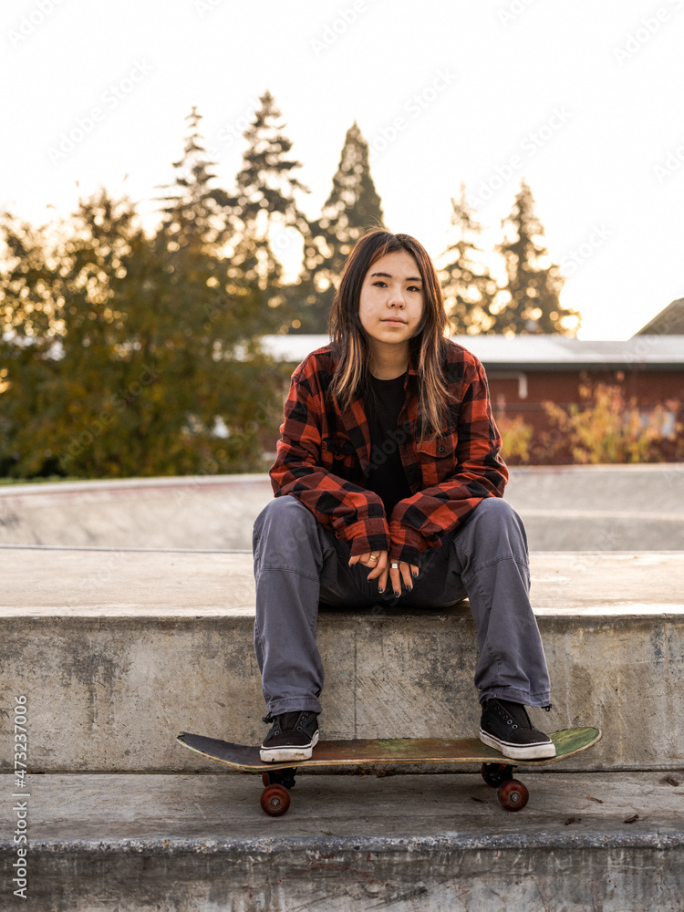 Young Indigenous nonbinary skater outdoors Stock Photo Adobe Stock