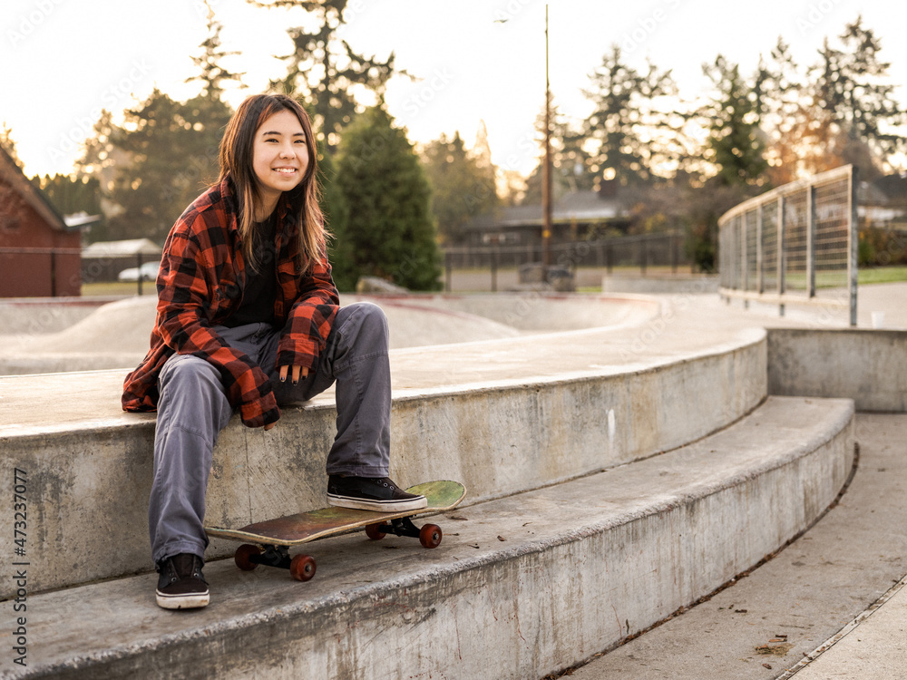 Young Indigenous nonbinary skater outdoors Stock Photo Adobe Stock