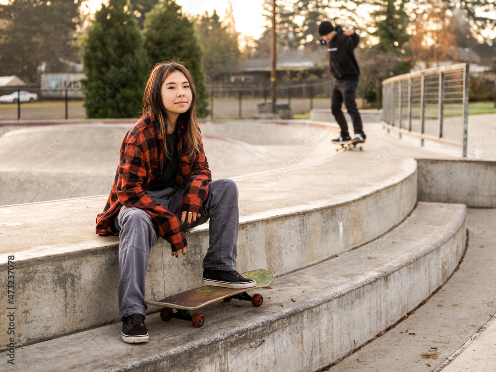 Young Indigenous nonbinary skater outdoors Stock Photo Adobe Stock