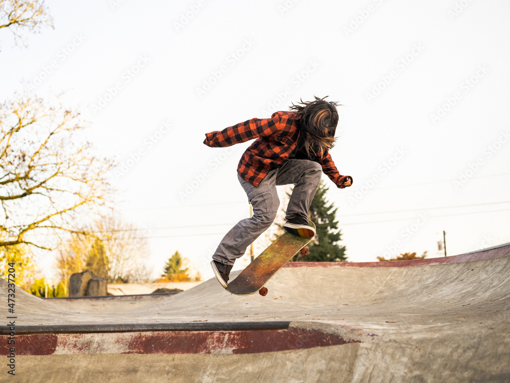 Young Indigenous nonbinary skater outdoors Stock Photo Adobe Stock
