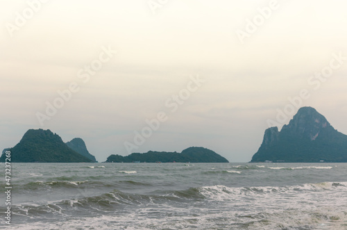 sea with the mountains view and sunset sky