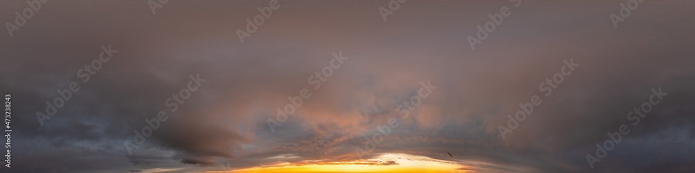 Obraz premium Red burning sunset sky panorama with Cumulus clouds. Seamless hdr 360 pano in spherical equirectangular format. Complete zenith for 3D visualization, game, sky replacement for aerial drone panoramas