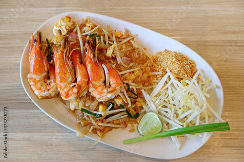Plate of Delectable Pad Thai or Thai Style Fried Noodle Topped with River Prawns