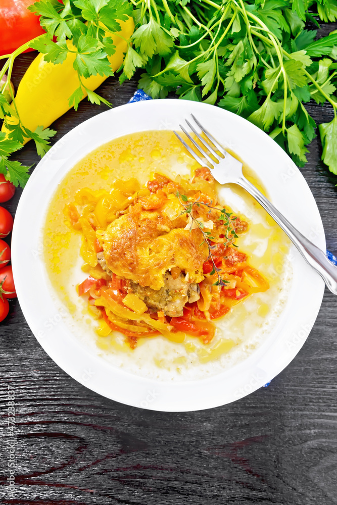 Chicken with pepper in white plate on board top Chicken with pepper in white plate on board top