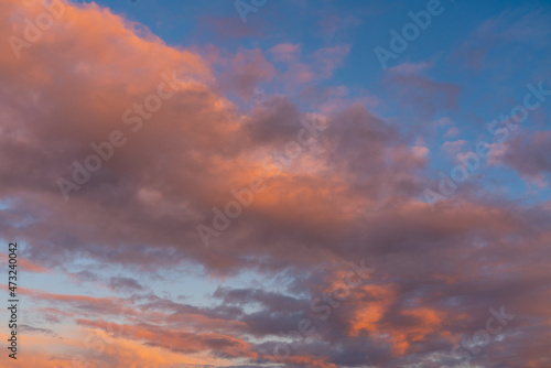 different colored clouds by sunset © denboma