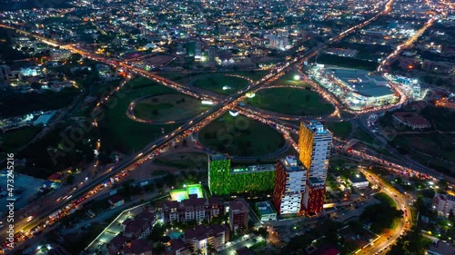 Aerial time-lapse view of traffic at night in Accra, Ghana during sunset photo