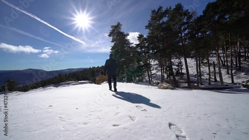 Man leaving footprints on the freshly fallen snow on the mountain. Guadarrama Madrid. photo