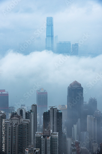 Photography Skyscraper in downtown of Hong Kong city in fog