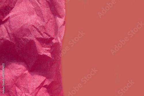 Trend color 2022. Pink crumpled background.