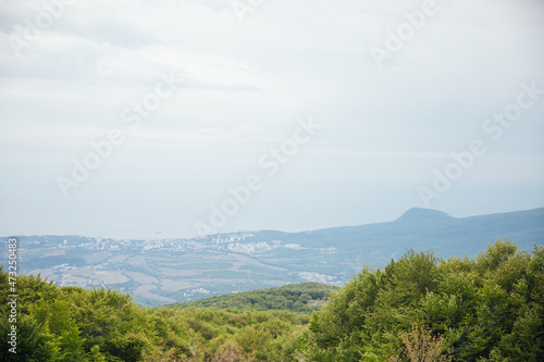 beautiful landscape on top of the mountain view of the forest and sky