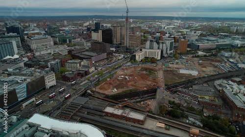 Pull out aerial over the Bull Ring Mall and the new construction of old sites in Birmingham England. photo