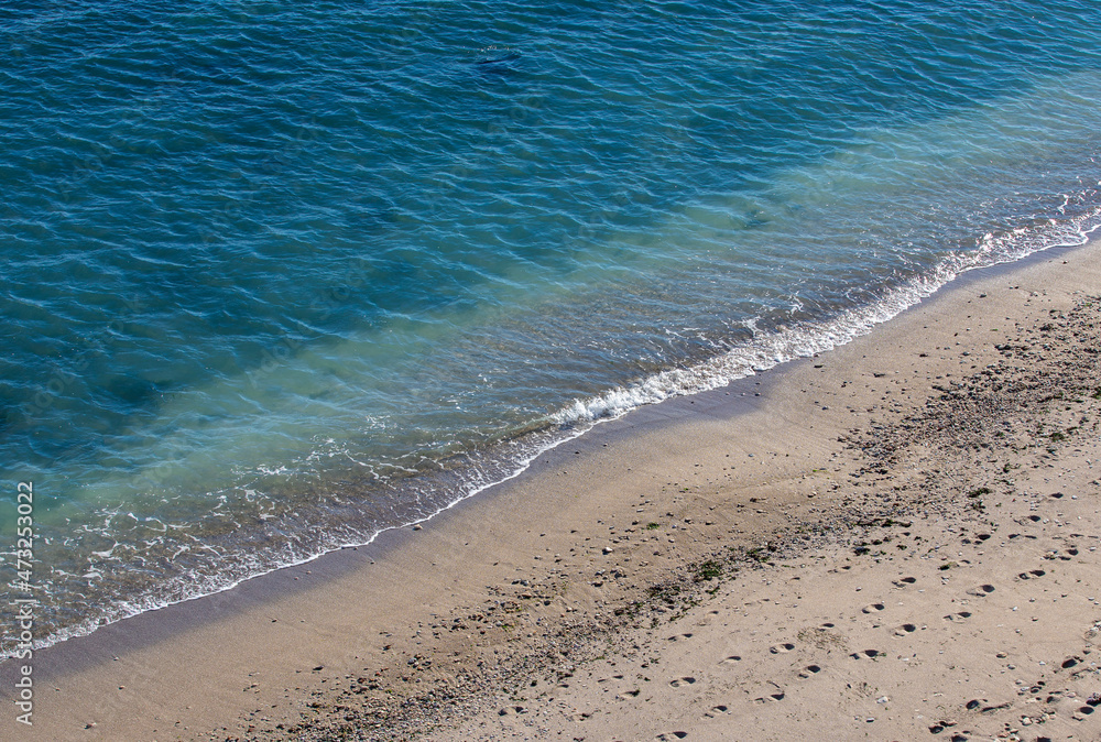 a small wave on the sand a small wave on the sand