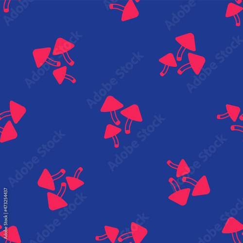 Red Mushroom icon isolated seamless pattern on blue background. Vector