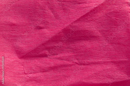 Trend color 2022. Pink crumpled background.