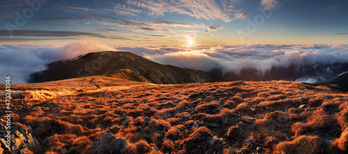 Fototapeta Naklejka Na Ścianę i Meble -  Meadows and Hills in Low Tatra Mountains National Park over clouds, Slovakia landscape in autumn